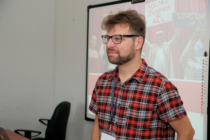 Portrait of Tristram Hooley giving a presentation